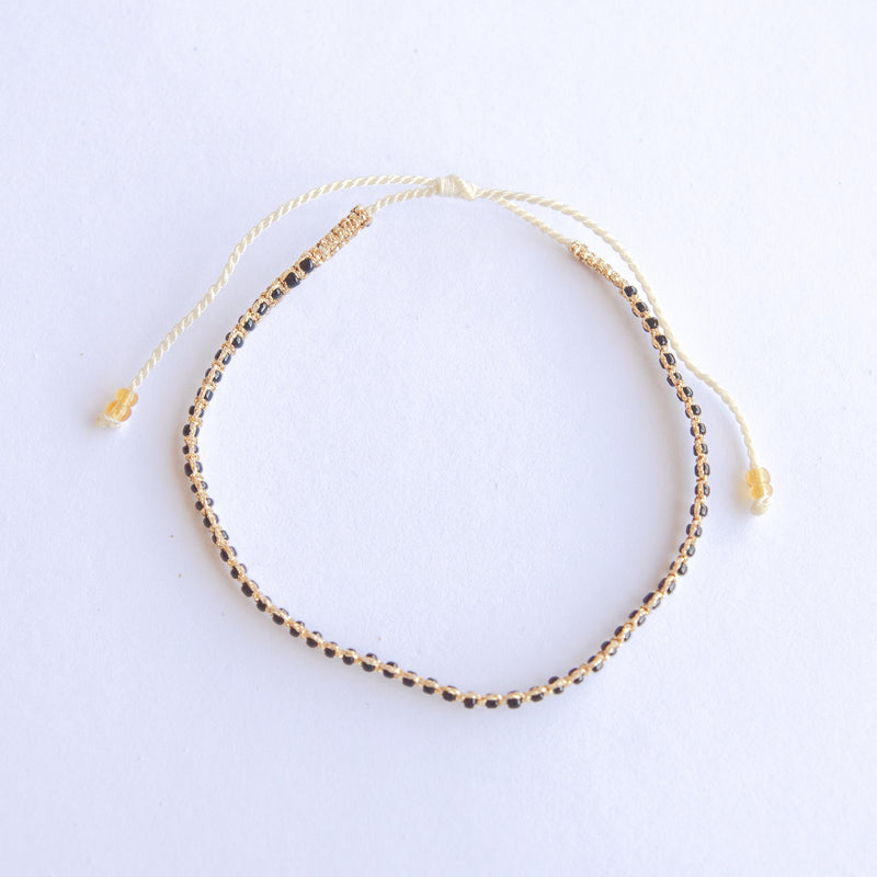 Add a pop of sparkle to your look with our Plating Bead Plain Anklets! These trendy anklets, made with seed beads and a touch of gold, are perfect for layering or wearing solo. Lightweight and durable, they’re an easy addition to your everyday style.