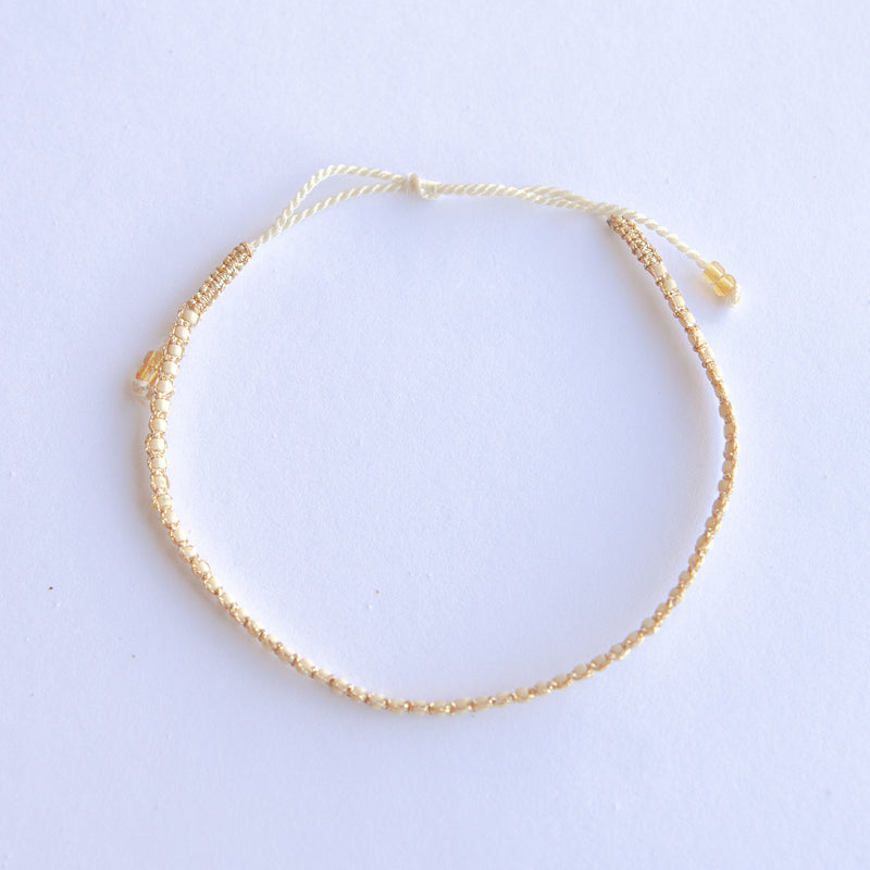 Add a pop of sparkle to your look with our Plating Bead Plain Anklets! These trendy anklets, made with seed beads and a touch of gold, are perfect for layering or wearing solo. Lightweight and durable, they’re an easy addition to your everyday style.