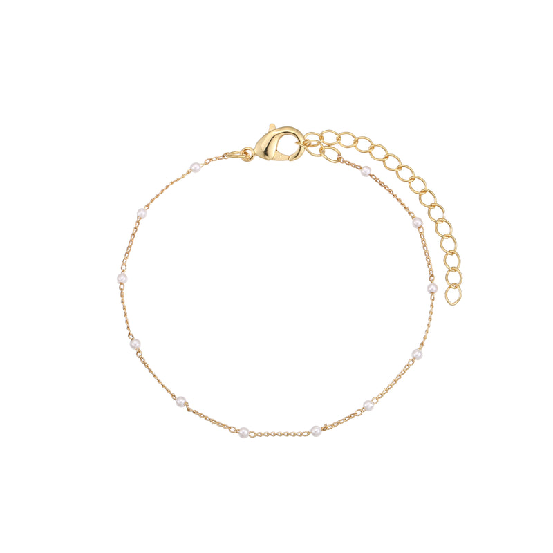 Check out our Petite Shimmer Imitation Pearls Bracelet, perfect for adding a touch of glam to your look! Made with high-quality brass and either gold or silver plating, this bracelet is durable and keeps its shine. The cute imitation pearls give it a stylish, timeless vibe, making it a must-have accessory for any outfit.