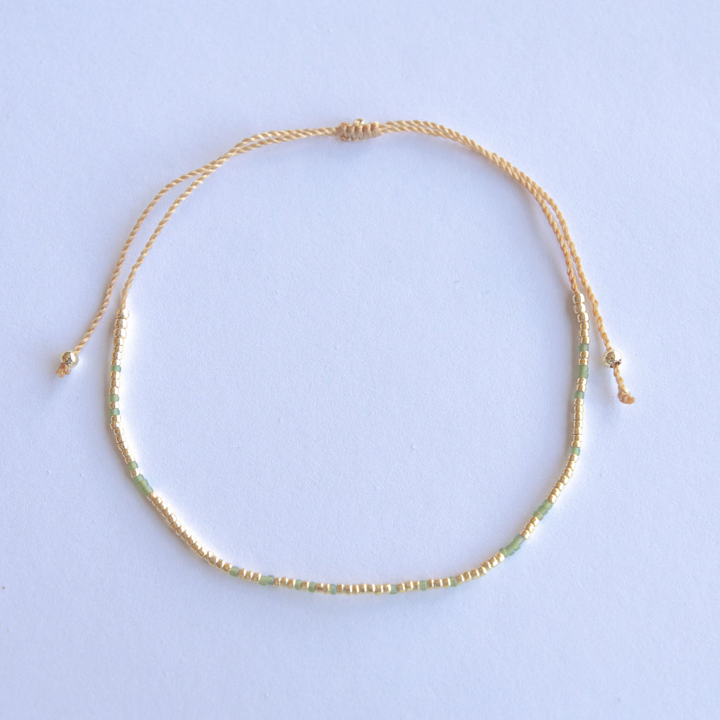 Add a pop of subtle color to your style with our Solo Beads Anklets. Featuring colorful and gold beads on an adjustable nylon string, these anklets are perfect for layering as we have five different colors available. Lightweight and comfortable, they’re ideal for everyday wear and special occasions alike.